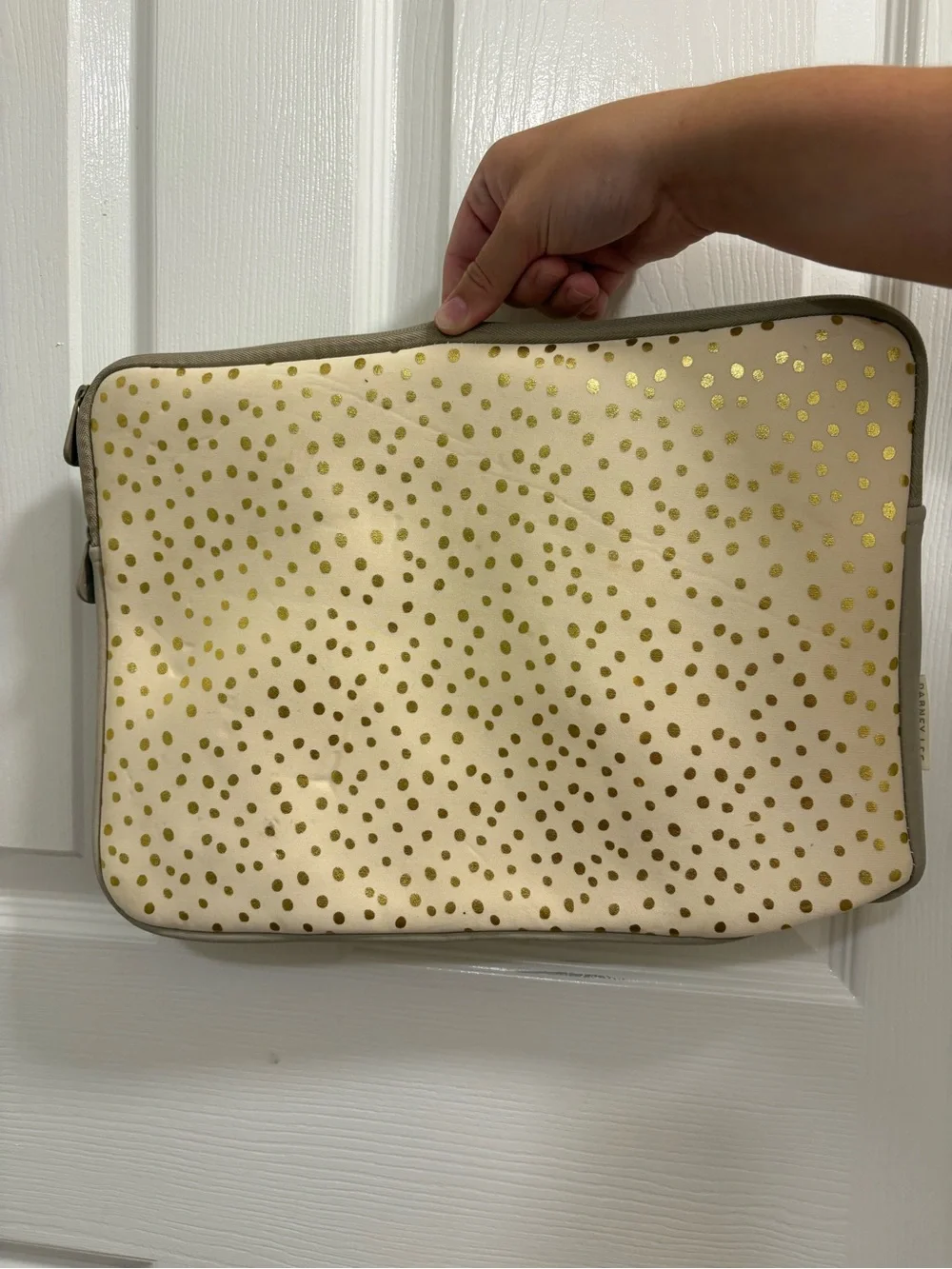 Dabney Lee laptop sleeve in the champagne gold polka dot pattern on cream